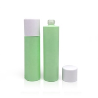 Bouteille en verre vert givré de sérum d'épaule plat recyclable de luxe avec couvercle de pompe à lotion blanche 80ml 100ml cosmétique pour les soins de la peau