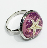 Bague ajustable en résine étoile de mer et fleur naturelle, style océan, avec coquille d'ambre, pour femme, idéale pour les fêtes estivales à la plage – Nouveauté très prisée