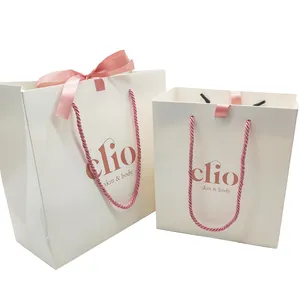 custom luxury eco-friendly reusable sustainable foldable kraft white paper gift bow shopping bags with ribbon logos