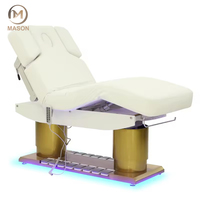 Nouveau lit de luxe pour salon spa et clinique 4 moteurs Table de massage électrique inclinable en cuir beige avec lumière LED pour salon Base dorée