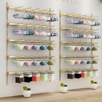 Présentoir à lingerie mural en or personnalisé avec étagère pour soutiens-gorge et sous-vêtements pour la décoration et le design de magasin