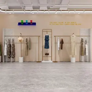 Progettazione su ordinazione del negozio della decorazione del negozio dello scaffale di vestiti del banco di mostra dell'abbigliamento della parete dell'oro per il negozio - Product Image 1