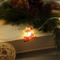 Mini Bonhomme de Neige LED sur Traîneau avec Lumières Féériques, Guirlande Lumineuse à 10 LED avec Figurines Festives, Câble Transparent pour Décoration de Noël
