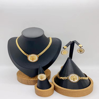 Plaqué or 18 carats collier en os de serpent boucle fleur pendentif collier boucles d'oreilles bracelet bague en acier inoxydable ensemble de bijoux pour femmes