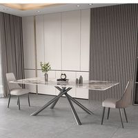 Table à manger extensible de luxe d'origine usine avec plateau en céramique transformable et pieds en métal