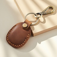 Porte-clés portable personnalisé avec pochette à monnaie en cuir véritable à la mode Tracker Cover Car Hanging Mini Storage Keychain