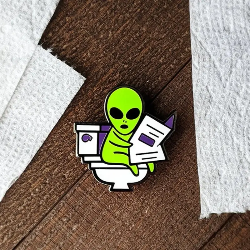 Custom your own design anime metal craft pin Cartoon Alien ET Read Newspaper Metal Badge cheap creat personal funny lapel pin