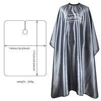 Cape de barbier imperméable finition satinée gris anthracite avec dos ouvert et col élastique pour salon de coiffure