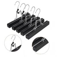 Vente en gros de cintres en bois personnalisés de haute qualité pour perruques et vêtements, robustes, pour présentation en salon, avec logo, antidérapants, pour extensions capillaires et usage domestique