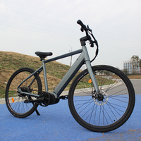 Vélo électrique VTT à transmission par courroie 250W avec moteur central Bafang pour le stockage en entrepôt et la conduite sur route de gravier