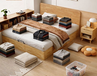Lit plateforme pneumatique moderne japonais minimaliste en pin massif avec rangement intégré et tête de lit fine sur pieds