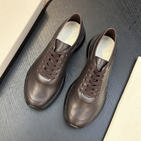 Sepatu Sneakers Pria Premium Kulit Asli Putih Sol Tebal Mewah Aksen Oranye untuk Jalan Santai Sehari-hari
