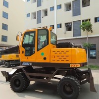 Scie à saisir Excavatrice Transport du bois Chargeuse de bûches Manutention de matériaux Machines forestières Ramasseuse à roues