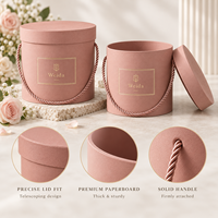 Boîte cadeau cylindrique rigide en carton texturé avec poignée en corde ronde, couvercle et base personnalisés avec logo, pour l'emballage de fleurs