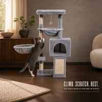 Arbre à chat multi-niveaux avec hamac, niche fermée et poteaux à gratter