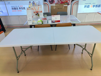 Table de salle à manger extérieure pliable STG de style européen moderne, rectangulaire, blanche, 180 cm, avec structure en plastique et métal, pour hôtel, parc, cour.