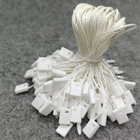 Étiquette de sécurité en plastique personnalisée à bas prix pour vêtements, avec logo, à suspendre, en forme de balle, pour la vente en gros