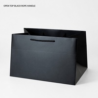 Sac shopping en papier noir A4 avec poignée en corde, design rectangulaire peu profond, pour cadeaux, événements commerciaux, vente en gros et impression personnalisée