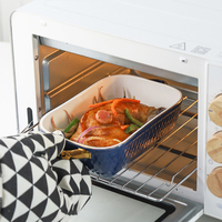 Vente en gros Nouveau produit Assiette ovale en céramique pour la cuisson du fromage et du riz avec double oreille dorée