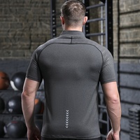 T-shirt de sport uni à manches courtes pour hommes européens et américains, col montant demi-zippé, séchage rapide, extensible, pour le fitness