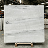 Marbre blanc colombien naturel poli, idéal pour les îlots de cuisine de villas, les murs et les escaliers des halls d'hôtels