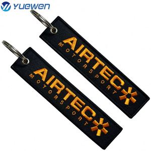 Porte-clés tissé personnalisé avec logo brodé pour avion, en tissu, avec nom de marque, vente en gros à prix réduit - Product Image 5