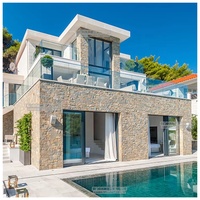 NEU 2024 Usine de Chine Prix bon marché Faux imperméable Panneau mural extérieur artificiel 3d Castle Rock Pu Stone Pour la décoration d'hôtel