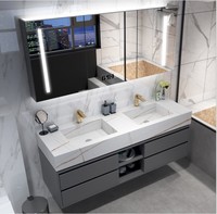 Meuble de salle de bain gris avec comptoir en marbre et double vasque