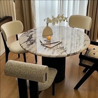 Table à manger en marbre de style crème moderne Plaque inférieure à support complet Conception ronde de haute qualité pour les petits ménages