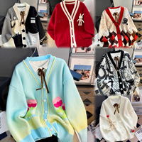 Femmes brodé Floral tricot Cardigan pull tissé à la main épais laine col en v à manches longues bouffantes en gros hiver Cardigan pull