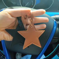 Porte-clés créatif étoile PU glands en cuir étoile à cinq branches sac de voiture pendentif à breloque petite boucle chaîne accessoire en cuir accessoire