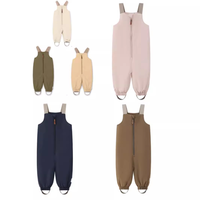 Vente en gros de vêtements pour enfants Vêtements d'hiver pour enfants Combinaison imperméable à l'eau Bretelles pour garçons et filles Salopette de neige épaisse et solide