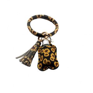 Pulsera de Cuero PU con Diseño de Gato y Cerdo de Dibujos Animados, Soporte para Desinfectante de Manos de 30ml, Llavero de Acero Inoxidable - Product Image 1