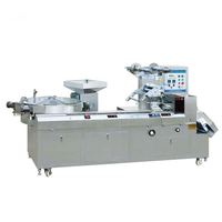 Machine automatique de découpe et d'emballage de bonbons gélifiés en forme de coussinets de sucre