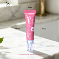 Tube d'emballage cosmétique rose à fleurs, haute qualité, vente chaude, avec logo personnalisé, en PETG, avec embout angulaire et bouchon à vis pour brillant à lèvres et gloss.