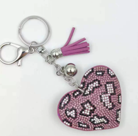 Koningsblauwe modieuze sleutelhanger met luipaardprint, hartvormig, volledig bezet met strass steentjes en kwastjes, best verkochte charme hangende ornament