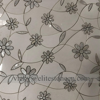 Mosaïque de marbre noir et blanc à motifs floraux en jet d'eau pour crédence de cuisine et carrelage mural de salle de bain