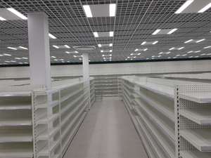 Estantería de góndola con tablero trasero y soporte de exhibición giratorio - Product Image 6