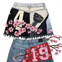 Short en jean brodé robuste style street goth, mini-jupe en maille patchwork numérique, jupe courte en jean délavé Y2K coupe ample