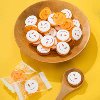 Vente de gros Bonbons Sourire 2 en 1 Presse à saveur de fruits Bonbons durs Bonbons colorés pour le visage Sourire
