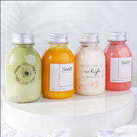 Bouteilles de jus en plastique PET rondes de 250 ml avec logo personnalisé, sans BPA, de qualité alimentaire, avec bouchon à vis en aluminium pour boissons, champagne, soda, lait, thé