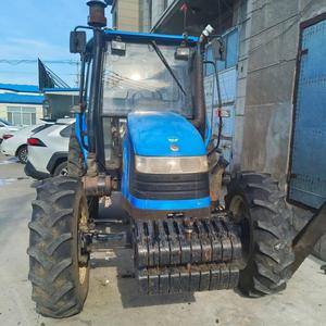 Tracteur à roues Shanghai Holland 804 d'occasion, 4x4, 80 CV, moteur diesel <span class=keywords><strong>4</strong></span> cylindres, boîte de vitesses, cabine fermée, bleu noir, 2000 heures de fonctionnement - Product Image 4