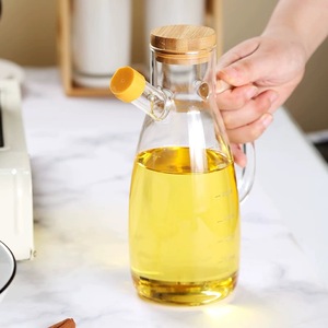 Gran oferta, botella de aceite de vidrio de borosilicato de 1000ml, cocina con dispensador de aceite de vidrio con mango, tapa de bambú y escala - Product Image 1