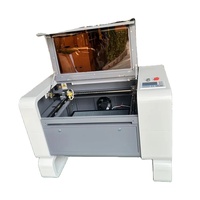 Machine de gravure laser CO2 portable refroidie par eau 6040 4060 50W 60W 80W 100W avec composants HIWIN et contrôle Ruida pour métal, bois, caoutchouc, IA