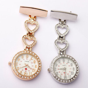 <span class=keywords><strong>Montre</strong></span> de <span class=keywords><strong>poche</strong></span> infirmière en forme de coeur en cristal de luxe pour femmes avec mouvement à quartz bande d'or cadeau de soins infirmiers ou paramédicaux médicaux - Product Image 1