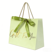 Sac d'emballage pour foulards et châles, sac cadeau vert avec inscription dorée et nœud en satin pour les produits d'accessoires de mode, cadeaux