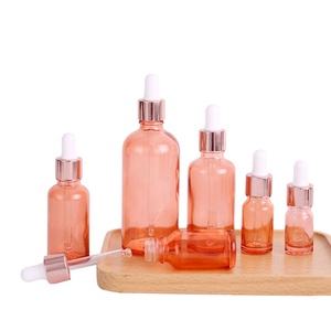 Flacon compte-gouttes rond en verre rose 2 oz, flacon compte-gouttes pour les yeux, flacons compte-gouttes or rose pour cosmétiques - Product Image 1