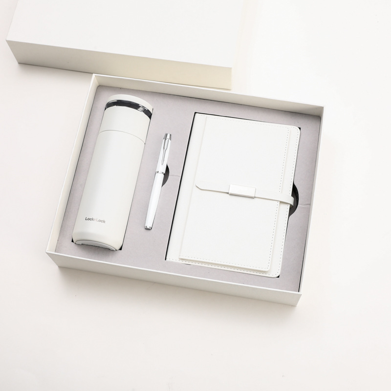 Lok bouton tasse signe stylo carnet blanc