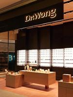 Comptoir de présentation de parfums en marbre au design intérieur unique pour parfumerie, armoire à parfums cintrée en placage de bois