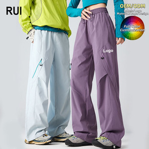RUIQUWIN Wholesale Unisex Soft Shell Waterproof Hiking Pants Quick Dry Durable Climbing Cargo <b>Trousers</b> Outdoor Sports - Product Image 1